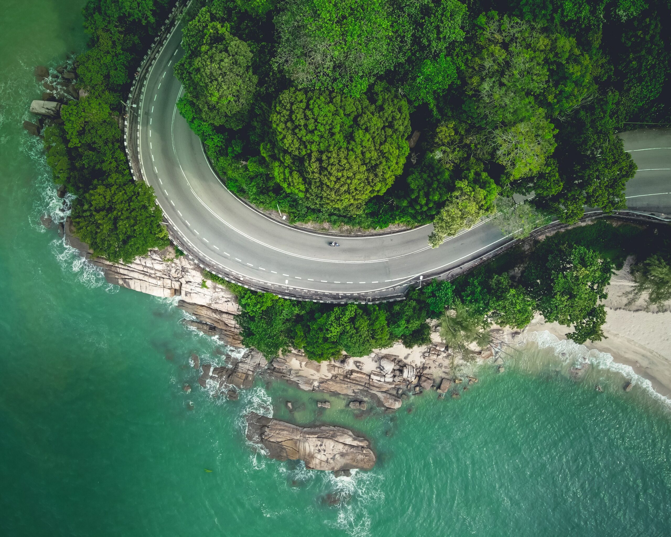 a hawk eye view captured through drone on the road at batu ferringhi penang island